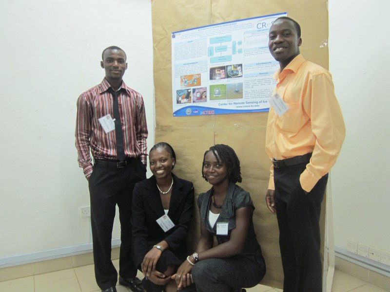 poster.JPG - Ghanaian students (from left: George Fordah, Linda Buame, Amadi Sefah-Twerefour, Prosper Adiku) with poster